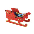 Red Santa sleigh with colorful candies on a white background.