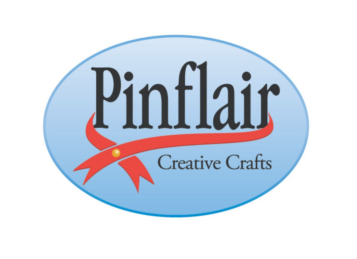 Logo of Pinflair Creative Crafts with a blue oval background and red ribbon.